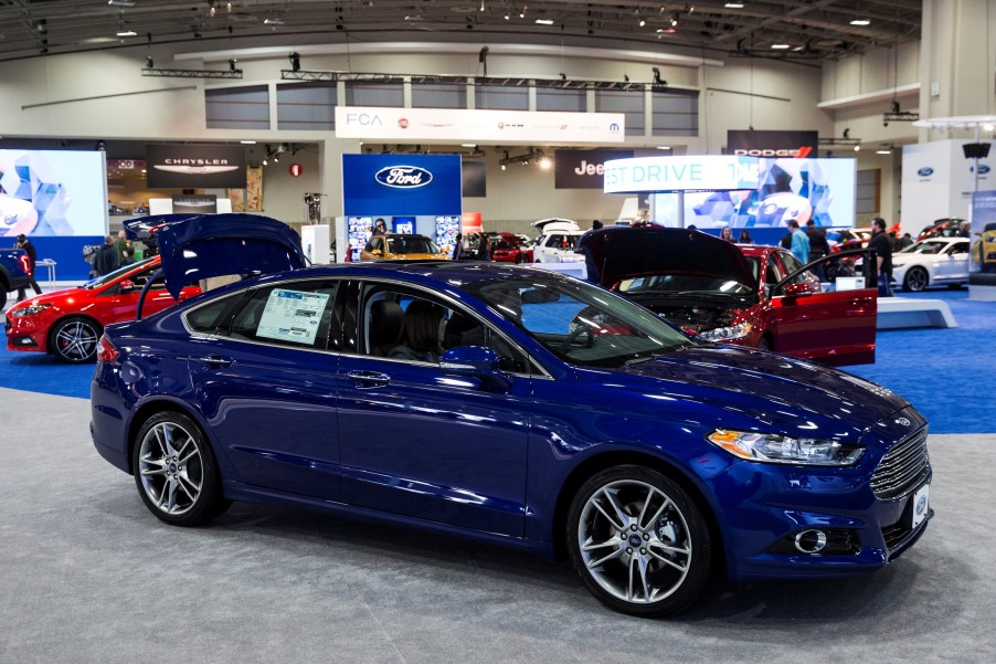 A blue 2015 Ford Fusion parked inside. It's one of the best used Fusion model years to buy.