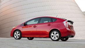 A red 2017 Toyota Prius parked, the Prius is among the best used hybrids