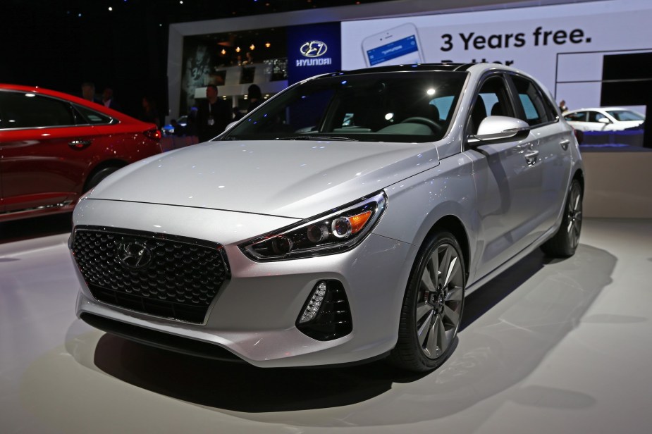 A silver 2017 Hyundai Elantra parked indoors. 