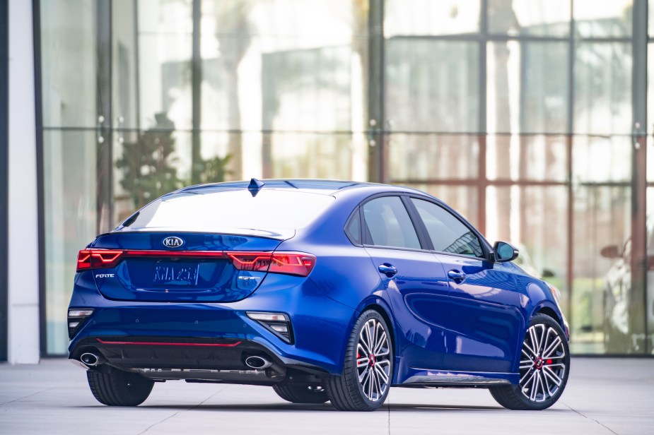 A 2020 Forte GT parked next to a glass wall