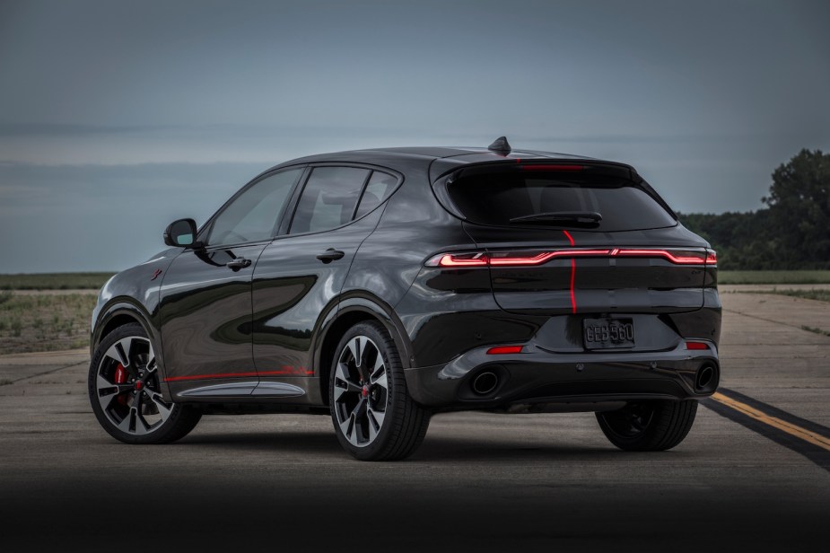 Black Dodge Hornet compact suv concept vehicle parked on the road, a gray sky visible in the background.