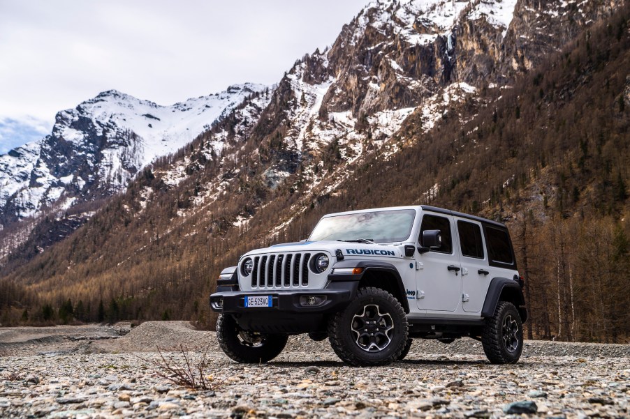 A 2022 Jeep Wrangler Rubicon 4xe plug-in hybrid SUV parked in the mountains