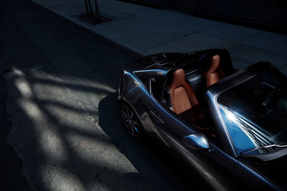 A grey 2022 Mazda MX-5 Miata with the top down