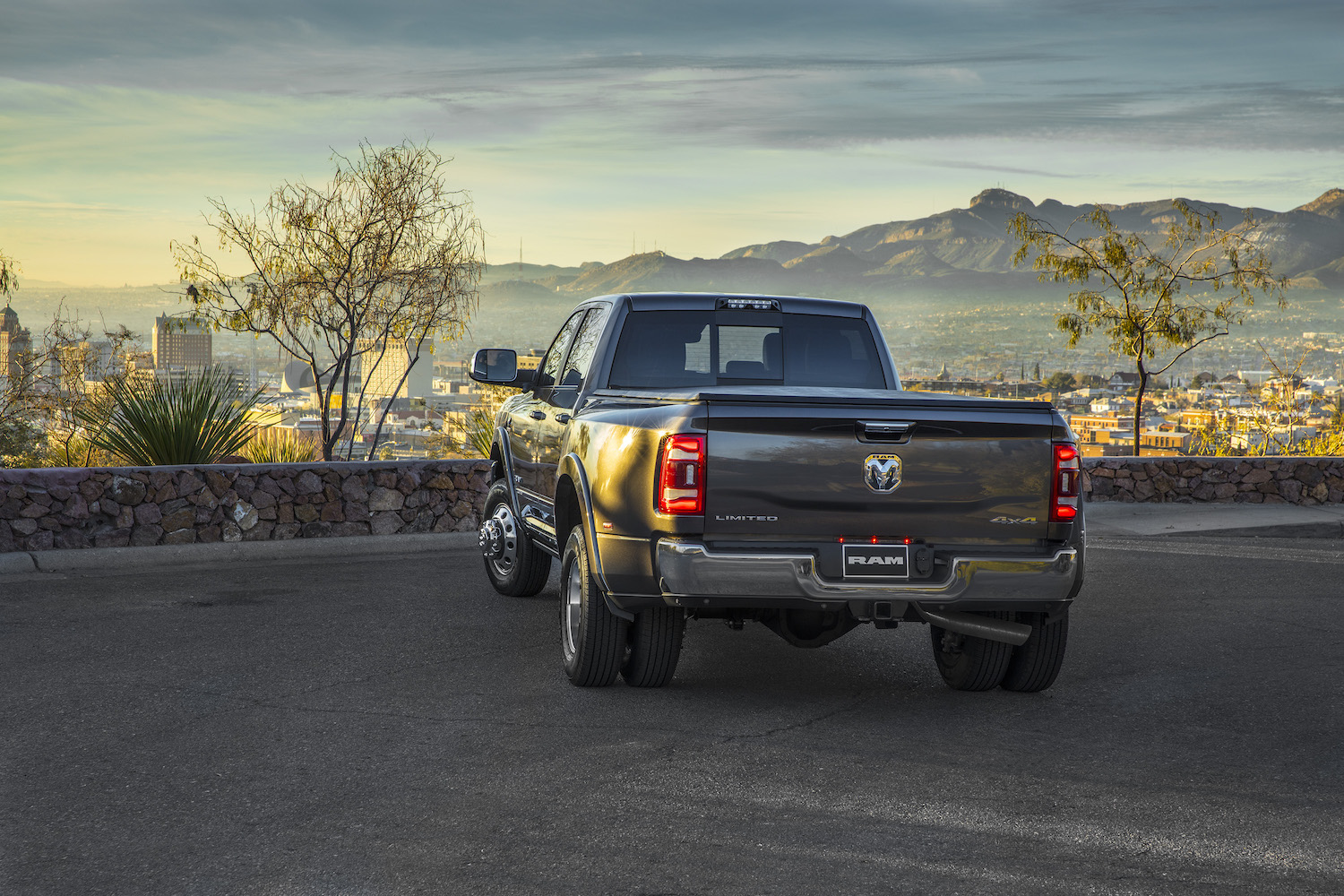 Gray Ram heavy-duty truck parked above a city.