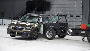 Action shot taken during the Institute's new side-impact crash test being conducted on the 2022 Subaru Outback SUV