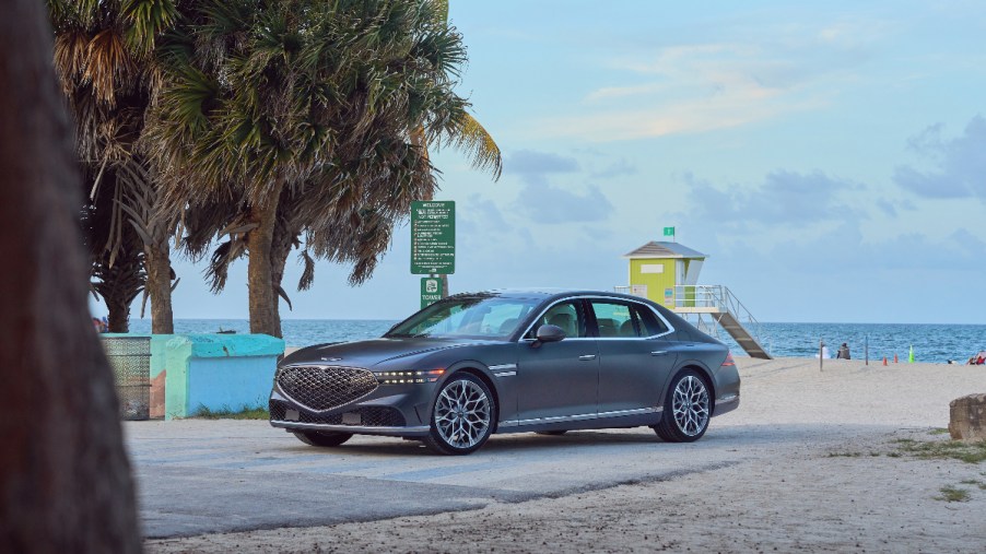 a new 2022 genesis g90 on a beach, a luxury sedan that is hard to beat