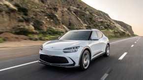 A front shot of a white 2023 Genesis GV60.