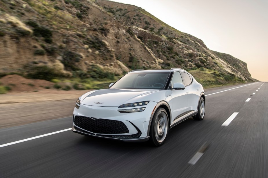 A front shot of a white 2023 Genesis GV60.