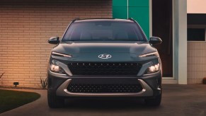 A blue 2023 Hyundai Kona subcompact SUV is parked.