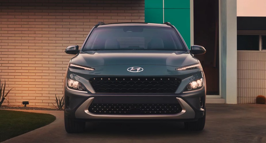 A blue 2023 Hyundai Kona subcompact SUV is parked. 