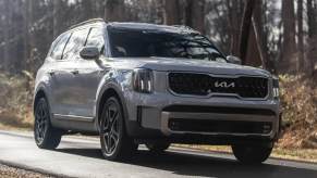 The 2023 Kia Telluride driving down the road.