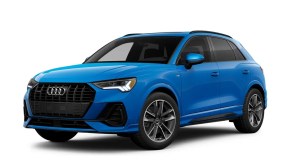 A blue 2023 Audi Q3 against a white background.