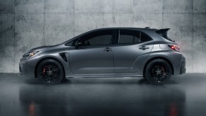 A silver 2023 Toyota GR Corolla parked indoors.