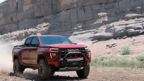 a red AT$x off-road Canyon in the dirt.