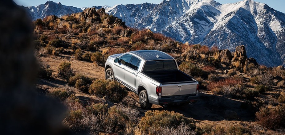 A 2023 Honda Ridgeline climbs up a steep hill as a mid-size truck.