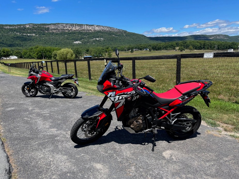 The Honda Africa Twin parked in front of a mountain