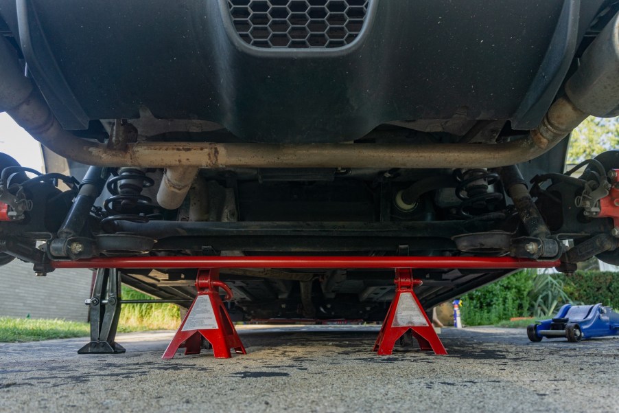 A red aftermarket Neu-f torsion bar mounted in the rear of a 2013 Fiat 500 Abarth