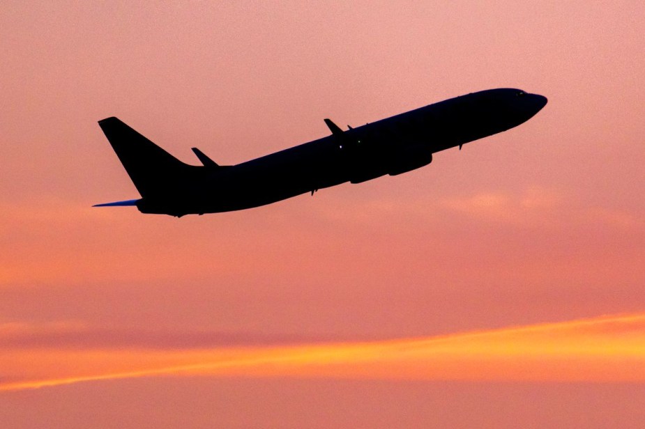 Airplane lights seen as craft is taking off at sunset