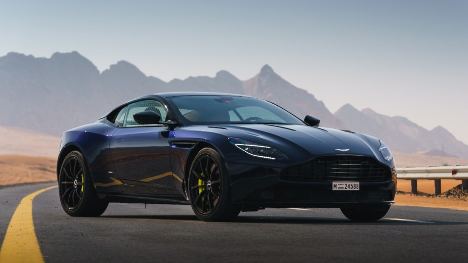 a dark blue aston martin db11, an exciting and luxurious british car