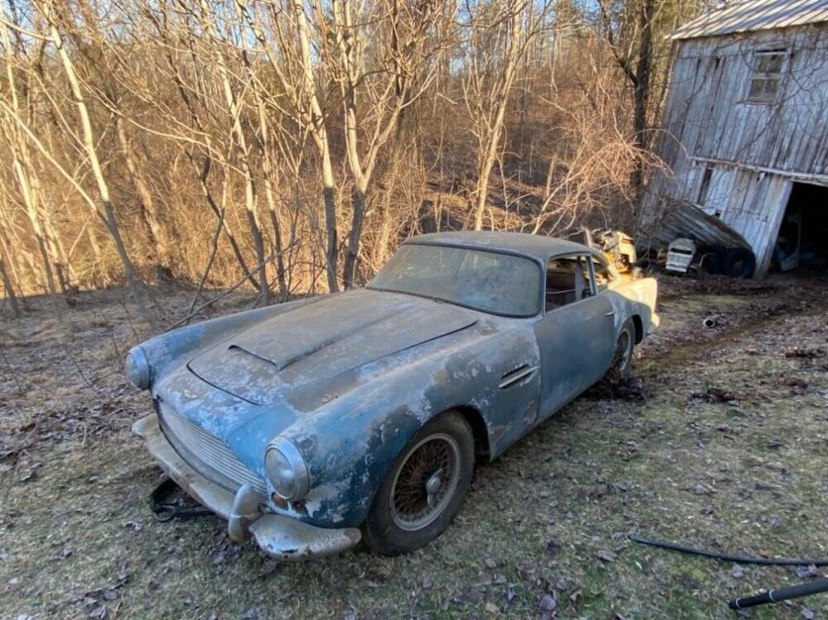 Aston Martin DB4 opulled from the garage into the yard