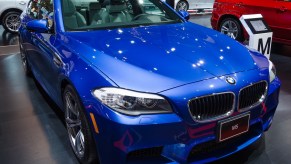 The BMW M5, like this blue one, is a used car faster than a Ford Mustang GT.