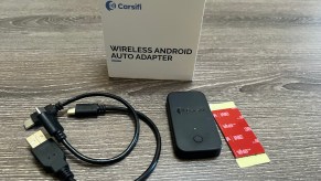 The Carsifi adapter with its USB cables and box.