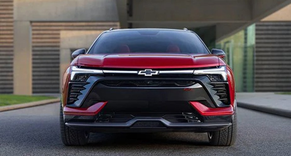 A red Chevrolet Blazer EV electric SUV is parked. 