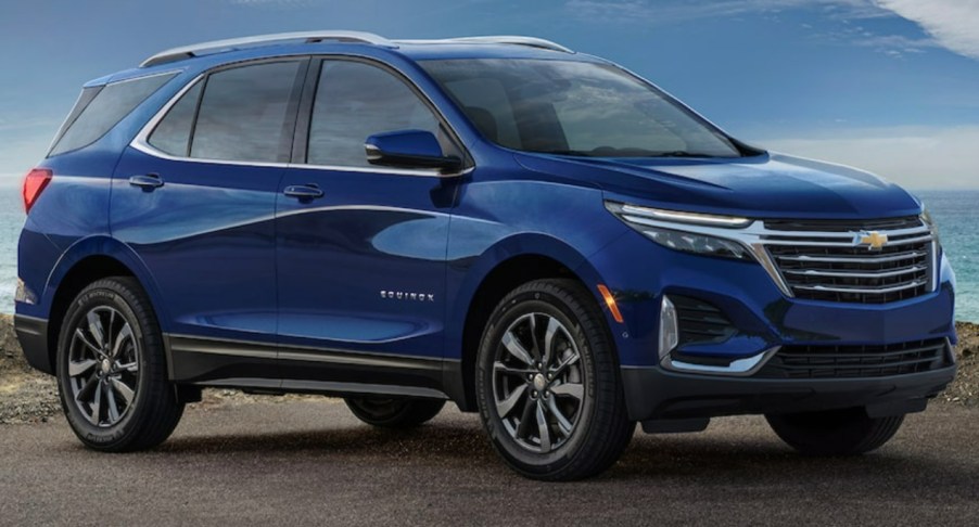 A blue Chevrolet Equinox small SUV is parked outdoors.