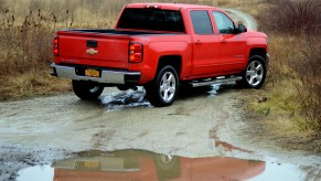 The rear end view of a 2016 Chevy Silverado 1500 in red.