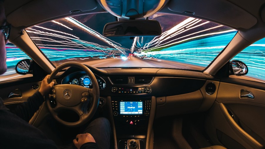 Dashboard of Mercedes-Benz car, highlighting why cars are designed to go over the speed limit