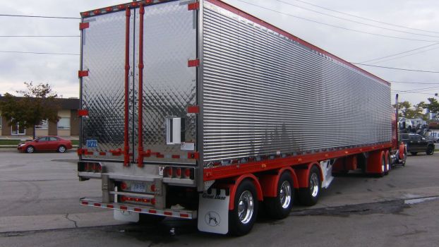 Why Do Some Semi Truck Trailers Have a Tiny Door Set Into Their Main Door?