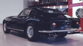 A black Ferrari 275 GTB two-seat grand touring coupé