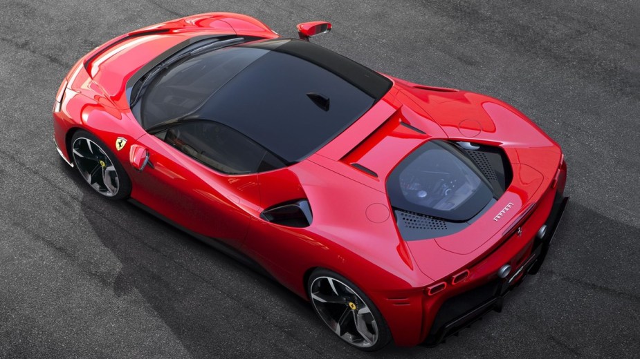 a red ferrari sf90 stradale, a taste of the future of ferrari with a hybrid powertrain