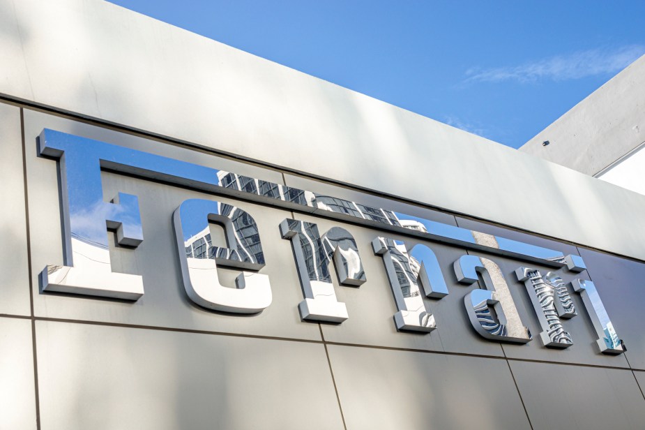 Ferrari written on the side of a building, as Ferrari Claims to Limit Autonomy to Preserve the 'Emotion' of the Car. 