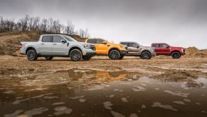 A group of Ford trucks is on display, including a 2023 Ford Maverick Tremor.