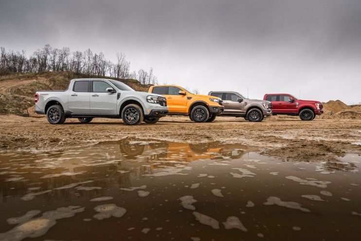 A group of Ford trucks is on display, including a 2023 Ford Maverick Tremor.