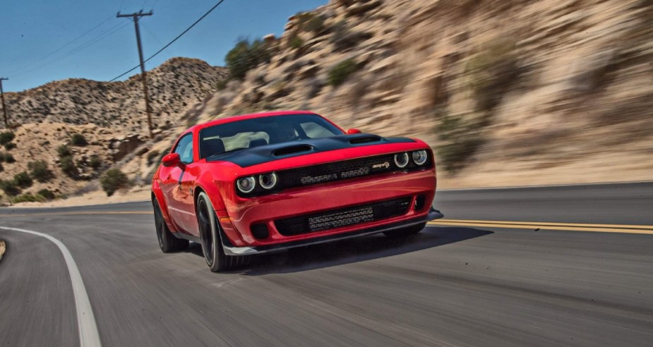 Front angle view of gas-powered red 2022 Dodge Challenger, which will be discontinued to make way for electric vehicles