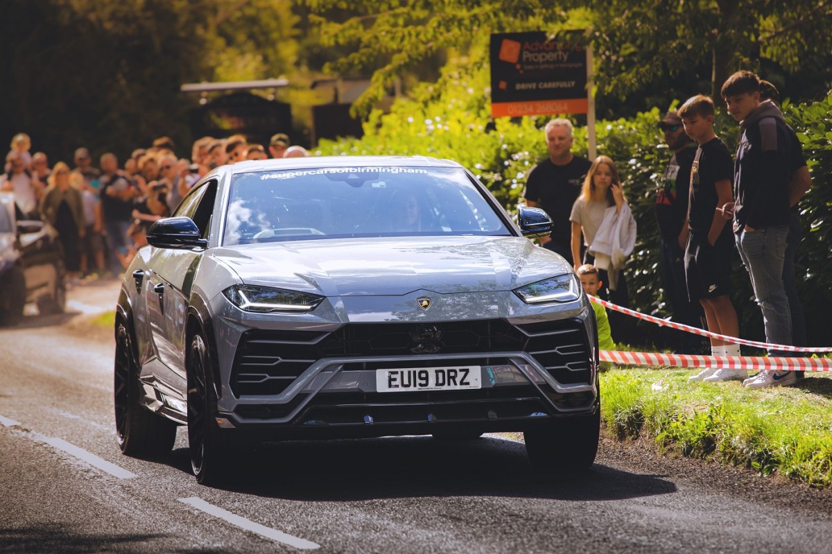 A grey Lamborghini Urus at a Supercar Sunday event. 