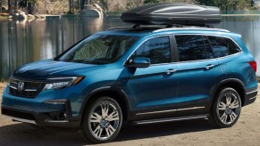 A blue 2022 Honda Pilot midsize SUV is parked outdoors.