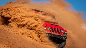 Jeep Wrangler running through the sand