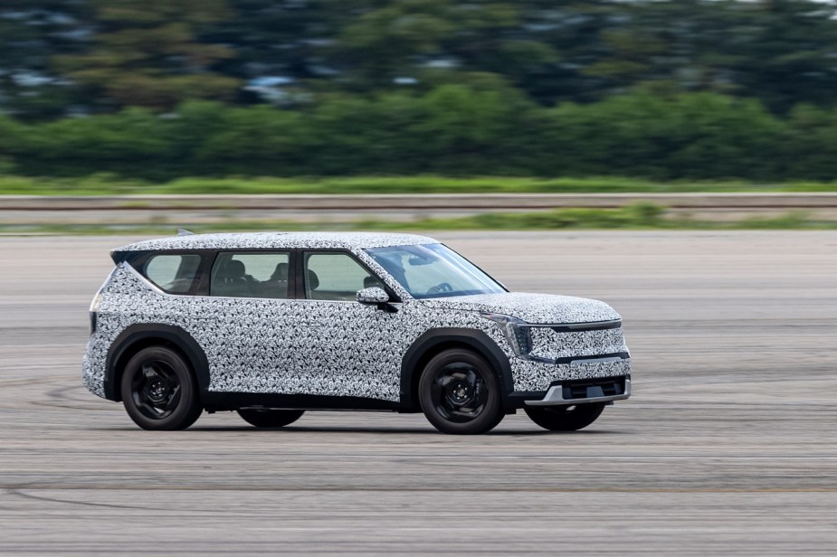 a photo of the EV9 in camp driving at speed in testing