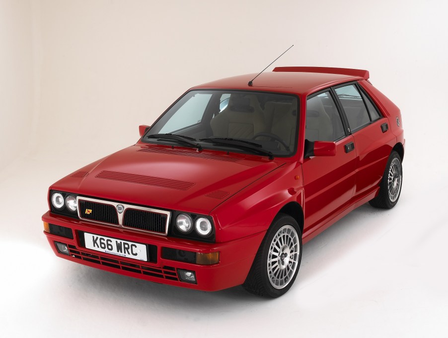 A red 1993 Lancia Delta HF Integrale Evoluzione (Evo) in a white studio