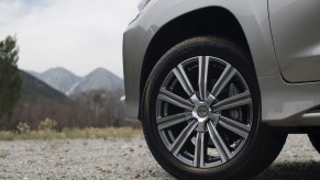 A Lexus SUV tire parked off-road on a trail