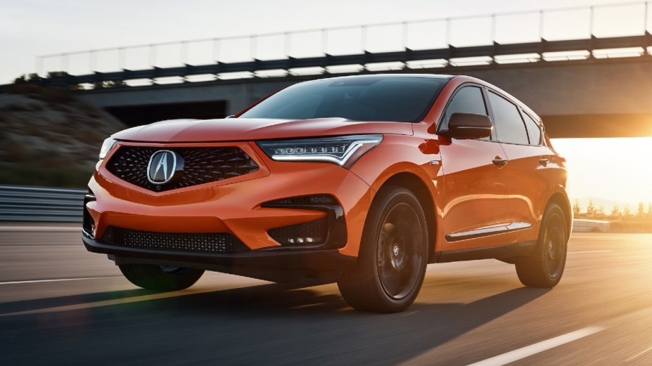 Orange Acura RDX Luxury SUV on the road