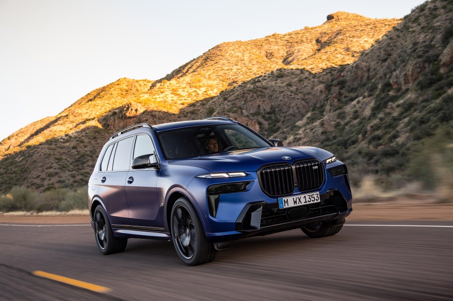 a blue 2022 BMW x7 on a mountain road