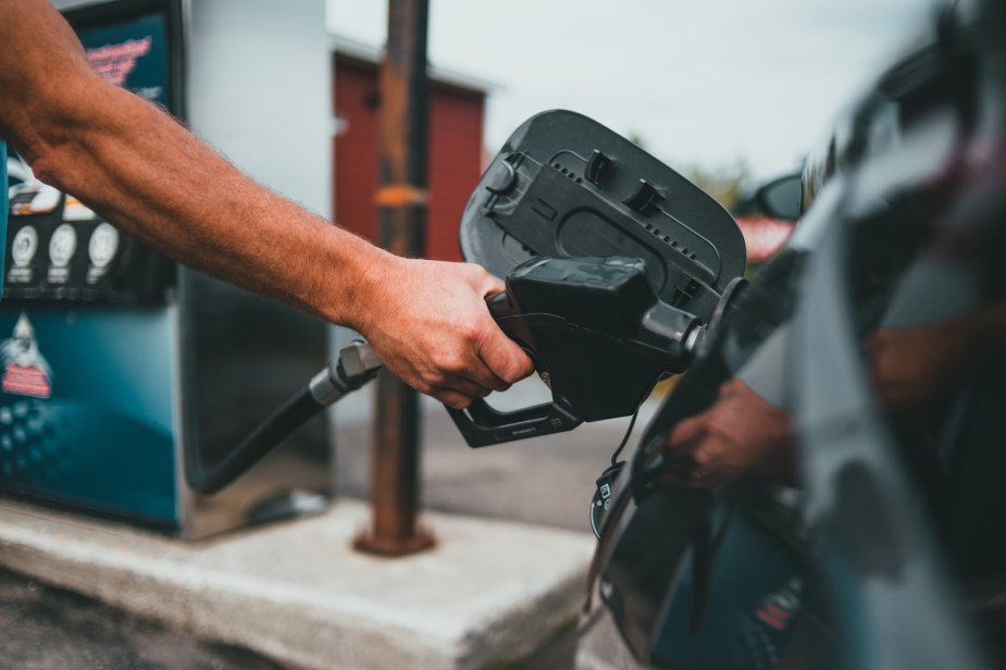 A man pumping gas