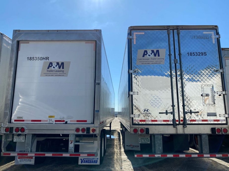 Side-by-side comparison of a semi truck trailer with a white painted door and a stainless steel door.