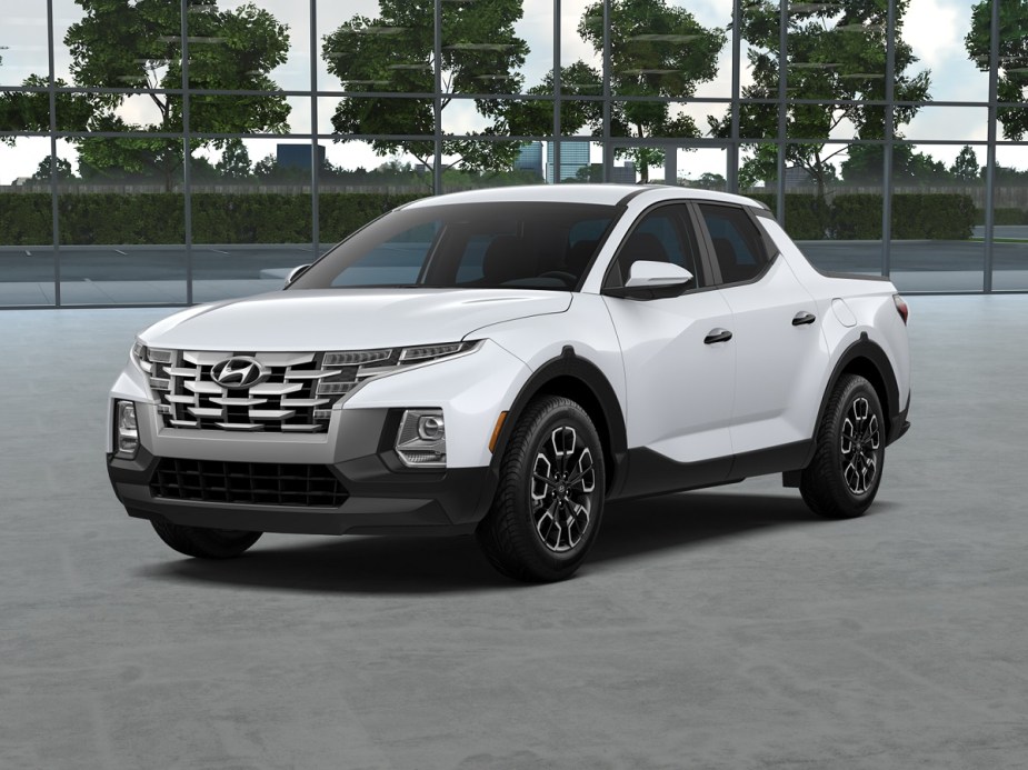 A white 2022 HYundai Santa Cruz in a parking lot.