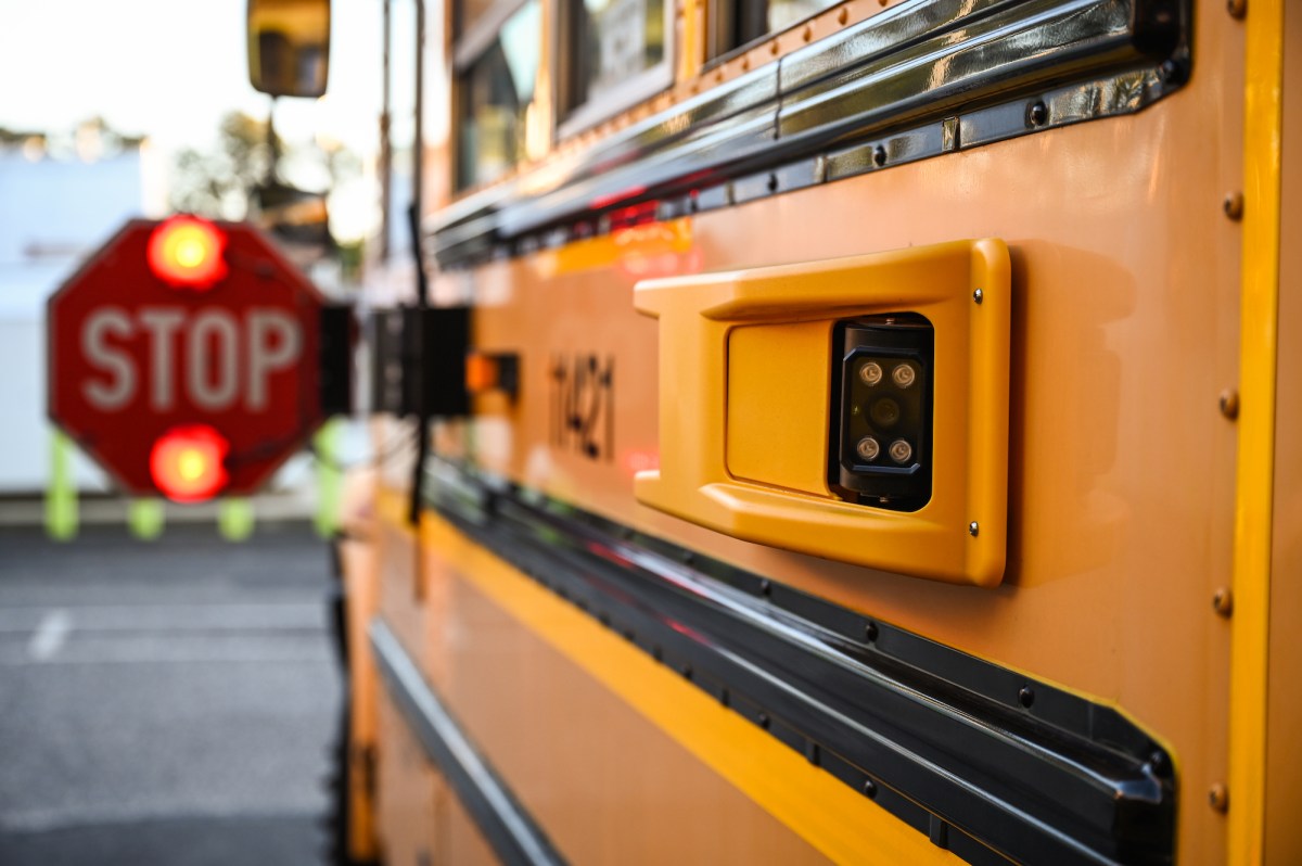 School bus with it's stop sign out.