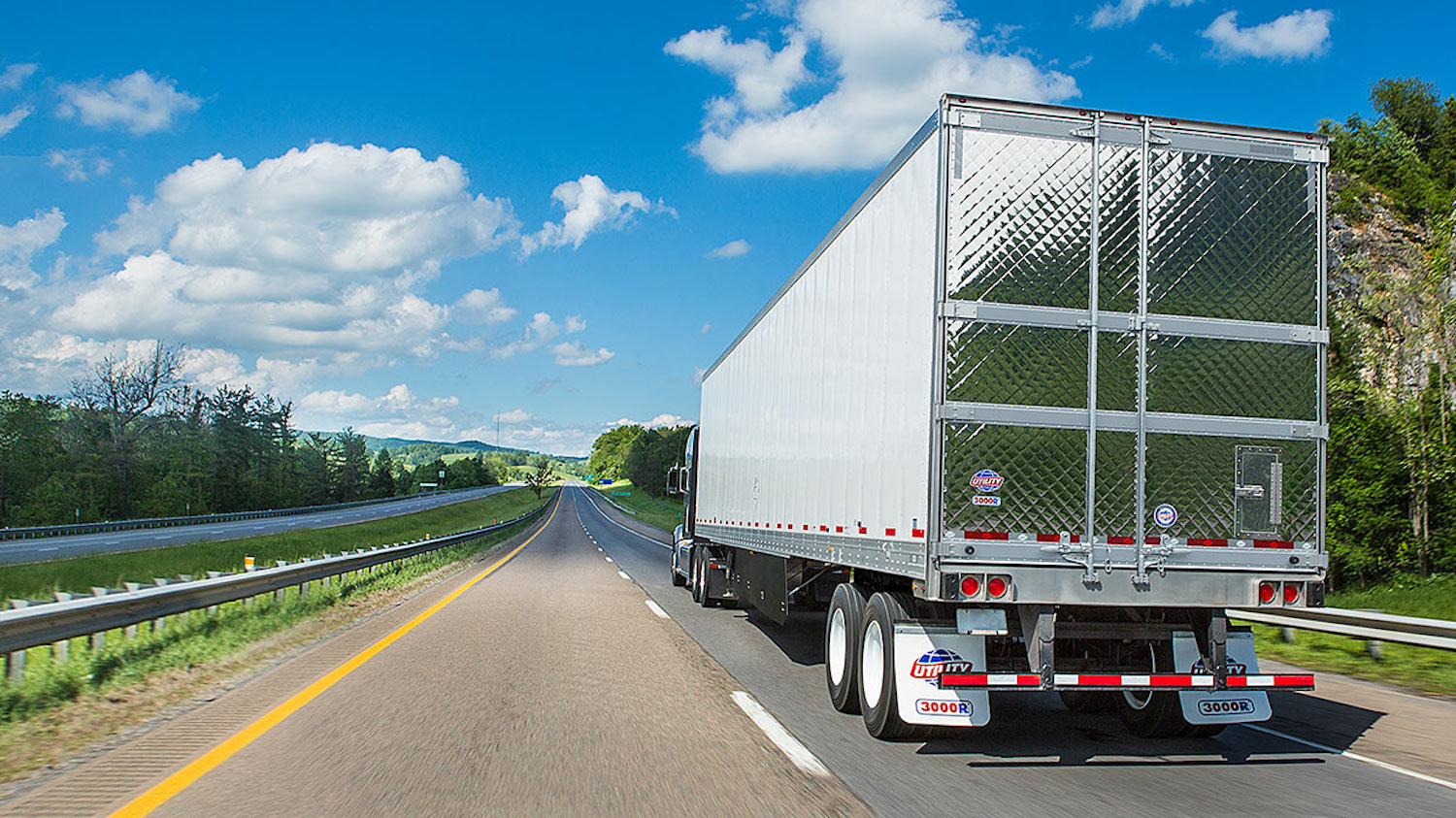 Advertising shot of the quilted rear stainless doors of a premium semi truck trailer.